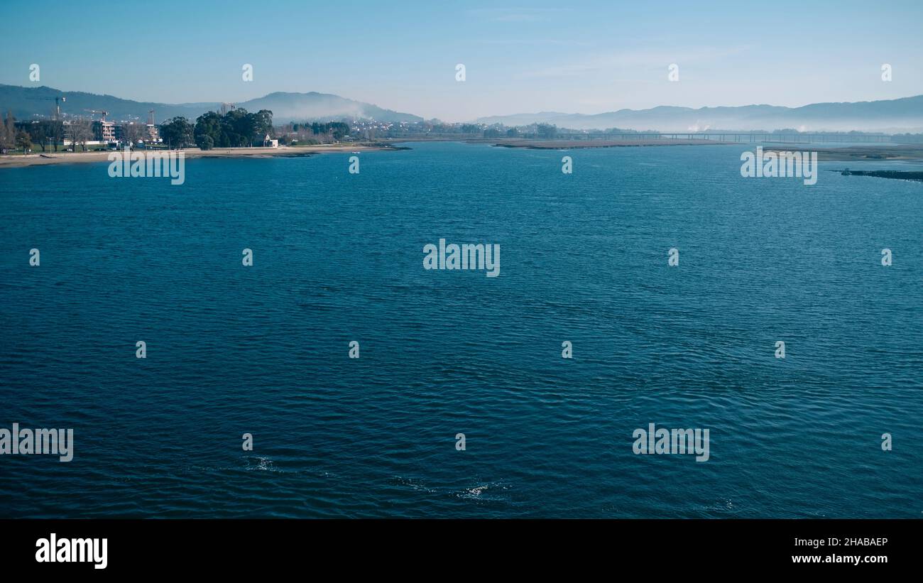 View of the Lima river at morning from the Eiffel bridge in Viana do Castelo, Portugal. Stock Photo
