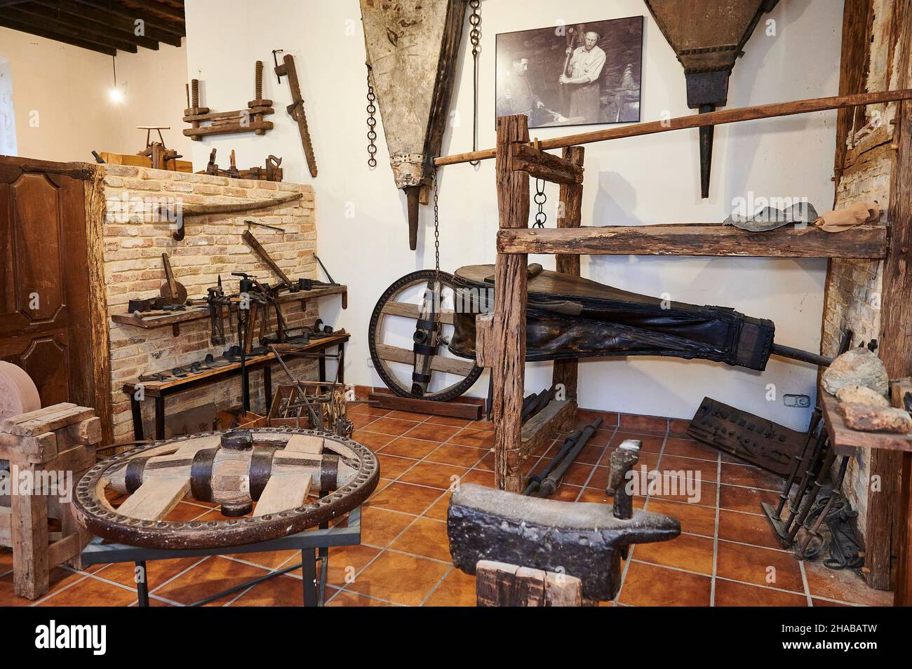 Old carpentry and blacksmith shop for the manufacture and repair of chariot wheels in the Atziniega ethnographic museum, Artziniega, Alava, Basque Cou Stock Photo