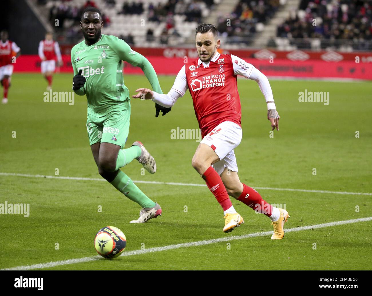 Anastasios Donis of Reims, Mickael Nade of Saint-Etienne (left) during the  French championship Ligue 1 football match between Stade de Reims and AS  Saint-Etienne (ASSE) on December 11, 2021 at Stade Auguste