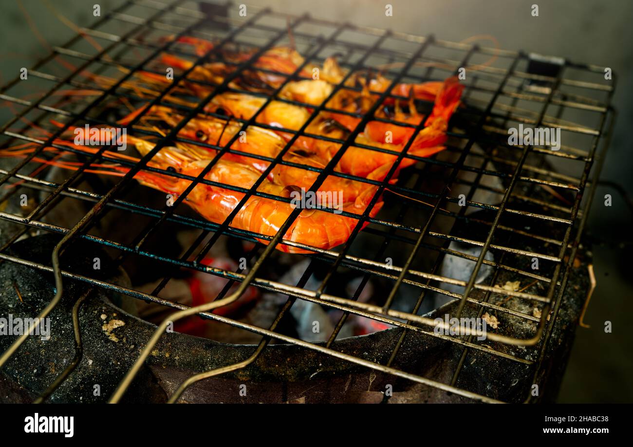 Grilled prawn on charcoal grill. Giant freshwater prawns grill on a