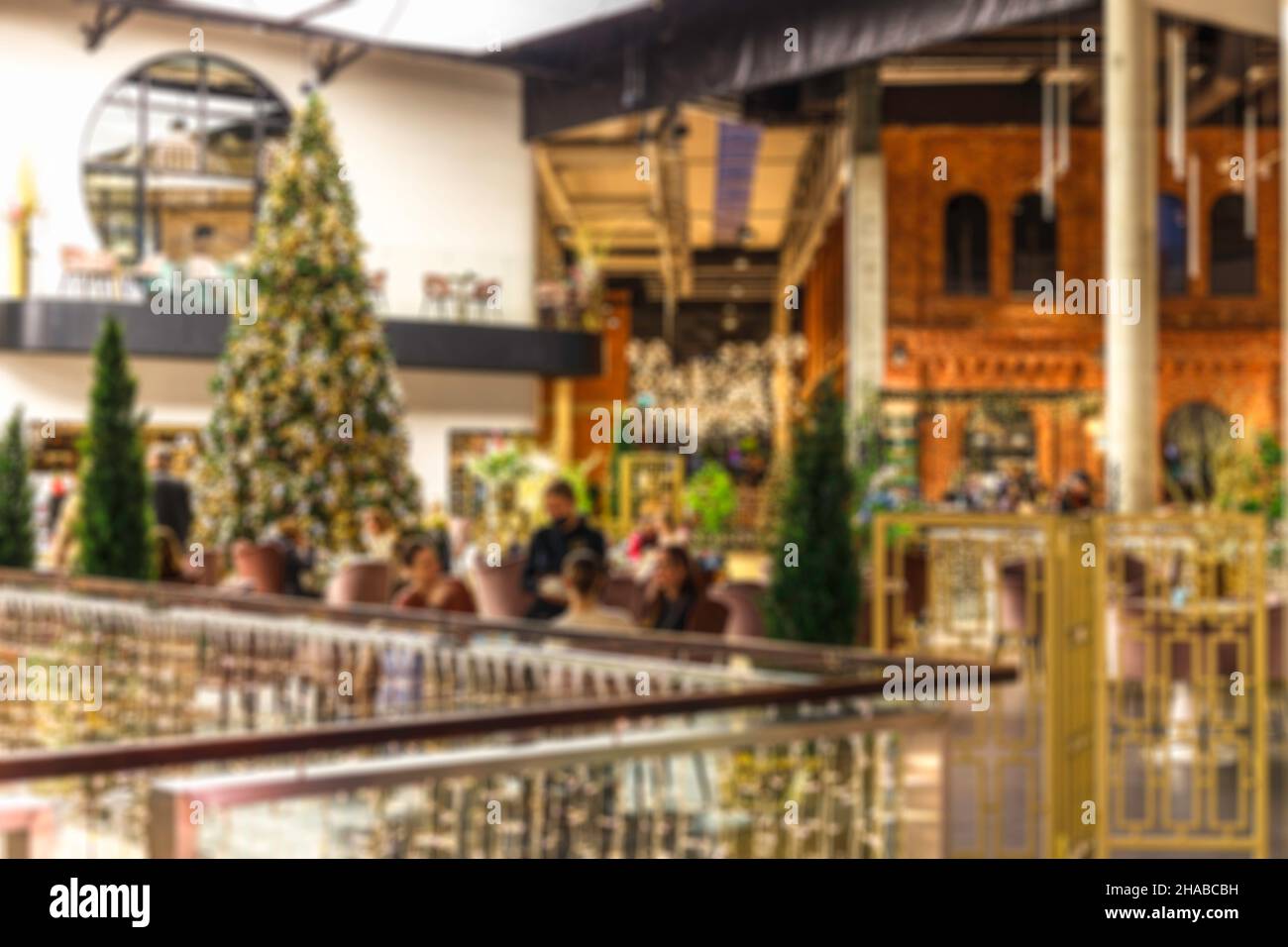 coffee shop blur background with bokeh and working man in a cafe Stock Photo