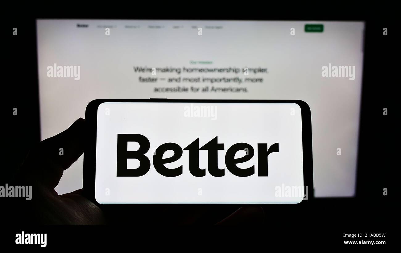 Person holding cellphone with logo of American financial company Better Mortgage on