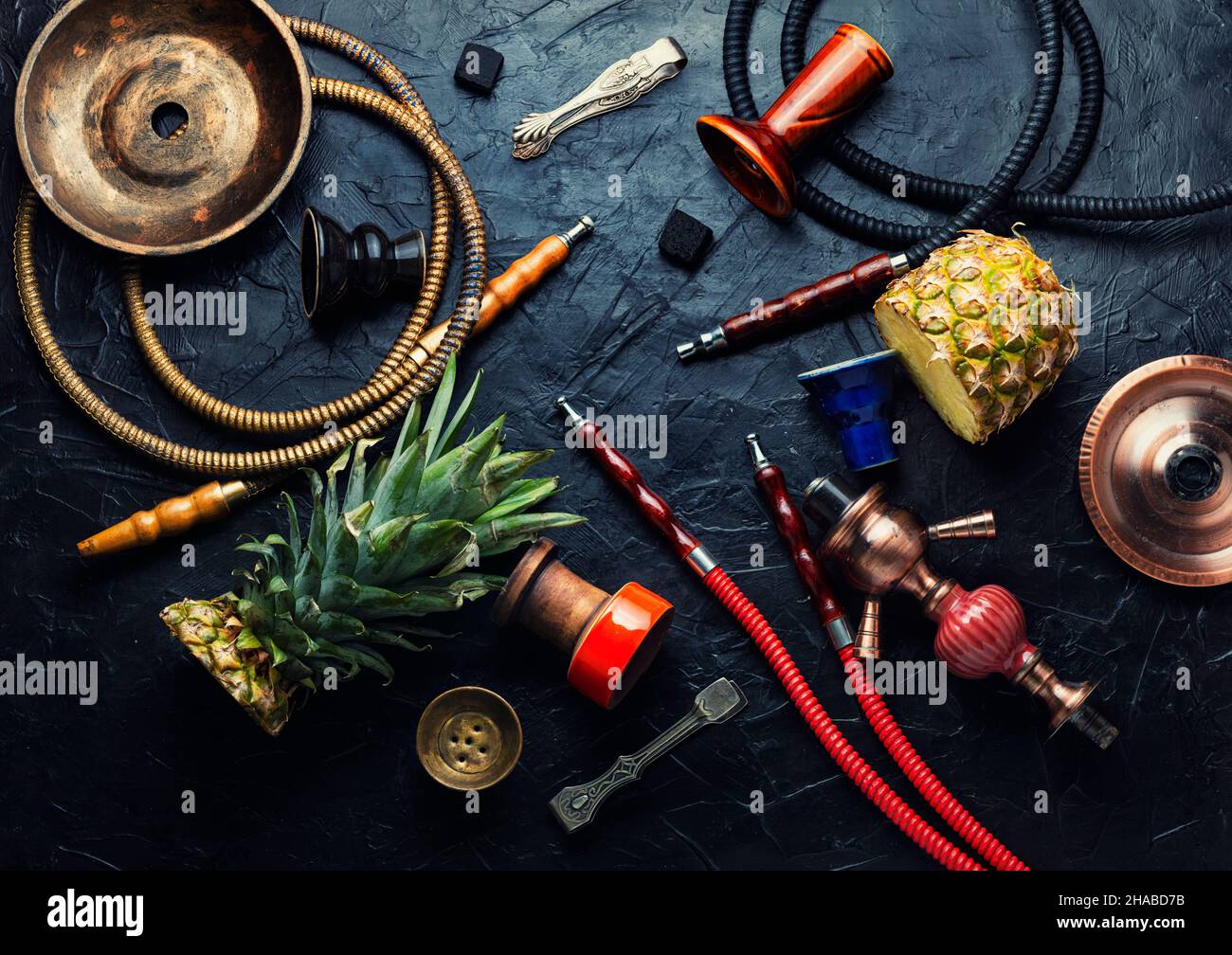 Smoking hookah with pineapple flavored tobacco. Oriental kalian Stock