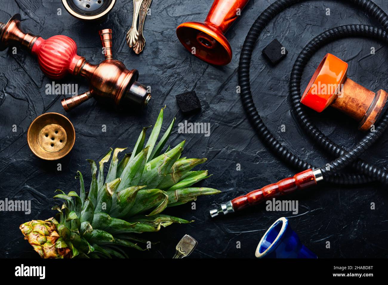 Smoking hookah with pineapple flavored tobacco. Modern hookah for