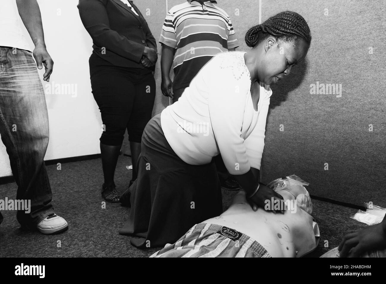JOHANNESBURG, SOUTH AFRICA - Aug 12, 2021: A grayscale shot of Aid CPR training with plastic dummy. Stock Photo