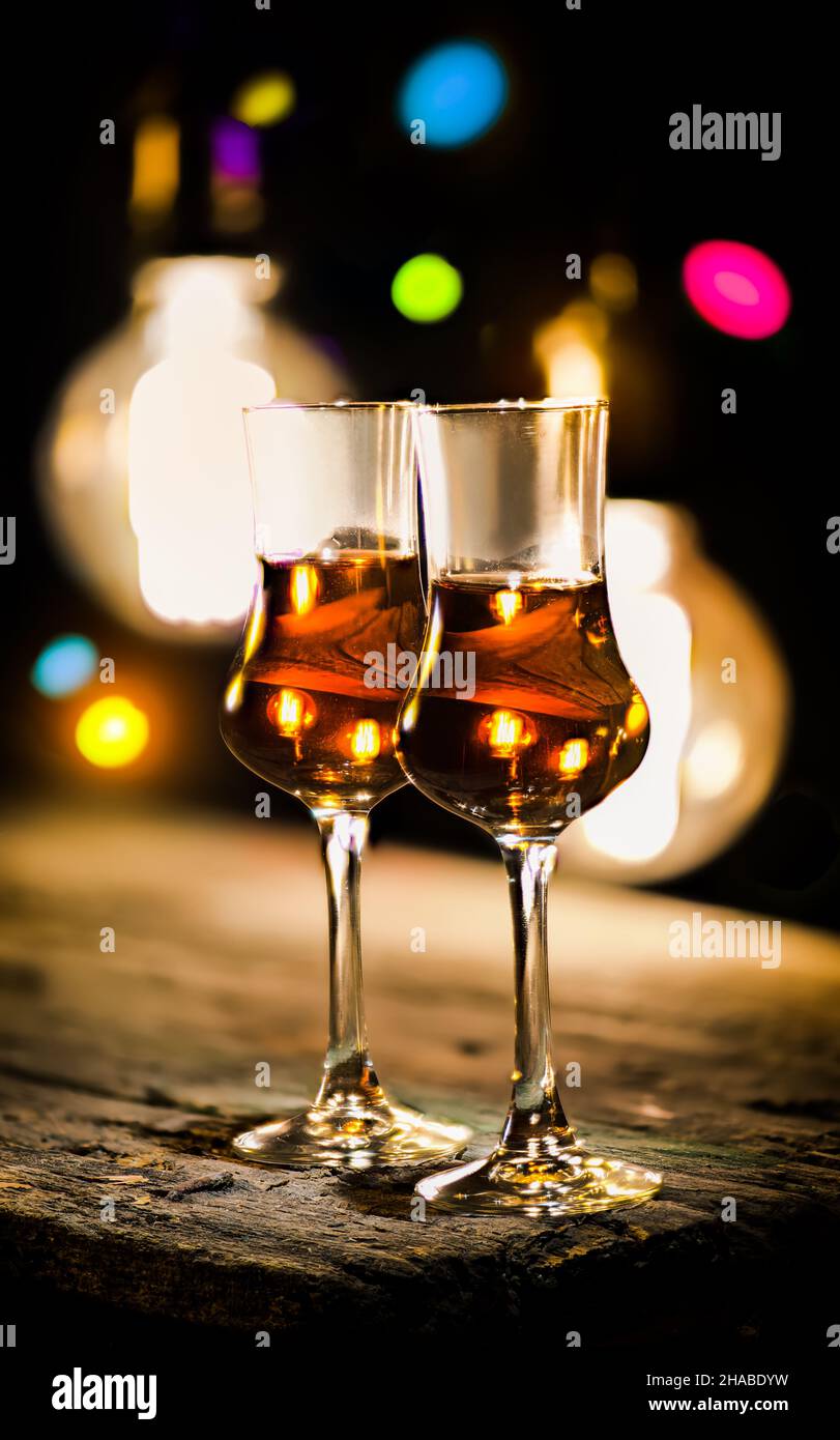 Brandy in a glass on a wooden table Stock Photo