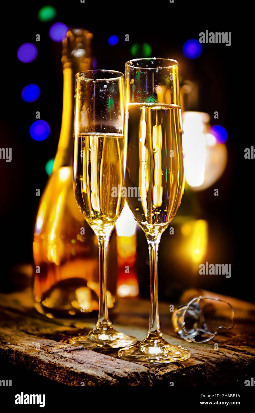 Glass and bottle of champagne on a black background Stock Photo