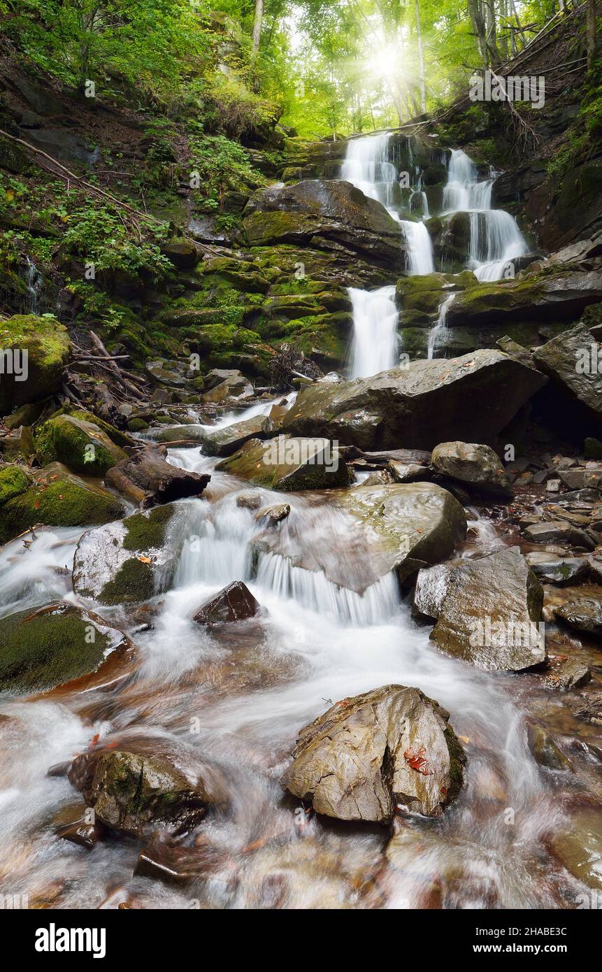 Mountain forest waterfall hi-res stock photography and