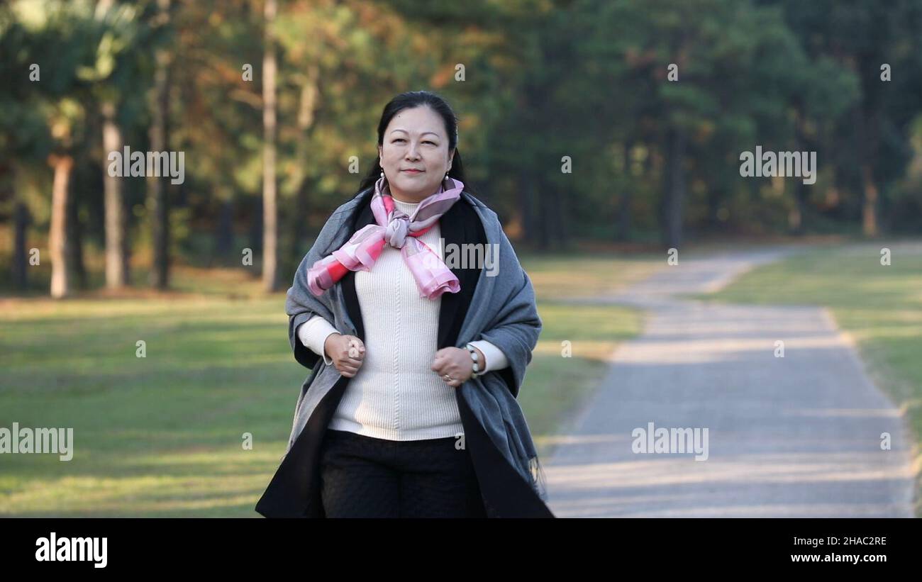 Xiamen, Dec. 7. 12th Dec, 2021. Video grab shows Chiang Pei-Chi taking a walk in her golf course in Lianjiang County of Fuzhou, southeast China's Fujian Province, Dec. 7, 2021. TO GO WITH XINHUA HEADLINES OF DEC. 12, 2021. Credit: Chen Wang/Xinhua/Alamy Live News Stock Photo