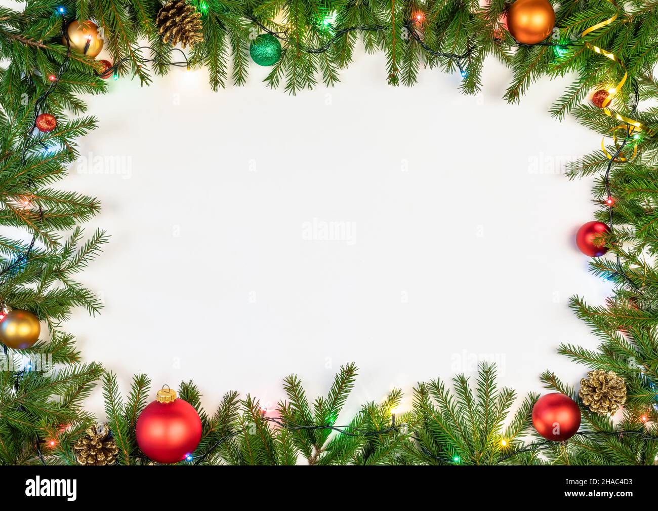 Christmas frame made of fir branches baubles cones and Christmas ...