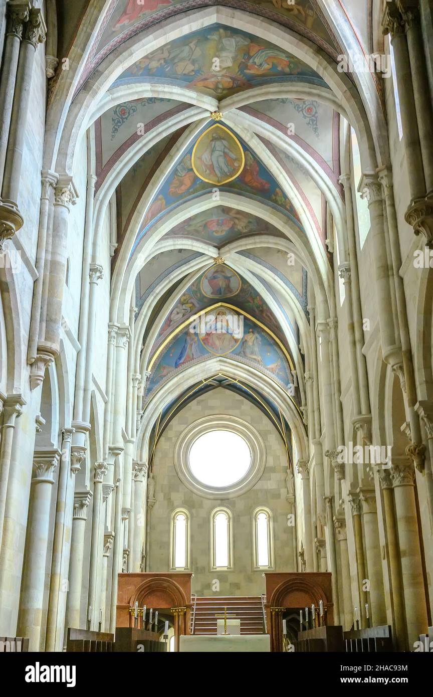 PANNONHALMA, HUNGARY - AUGUST 13, 2021: Interior of Pannonhalma Benedictine abbey with the painting of the ceiling in front of the altar in Pannonhalm Stock Photo