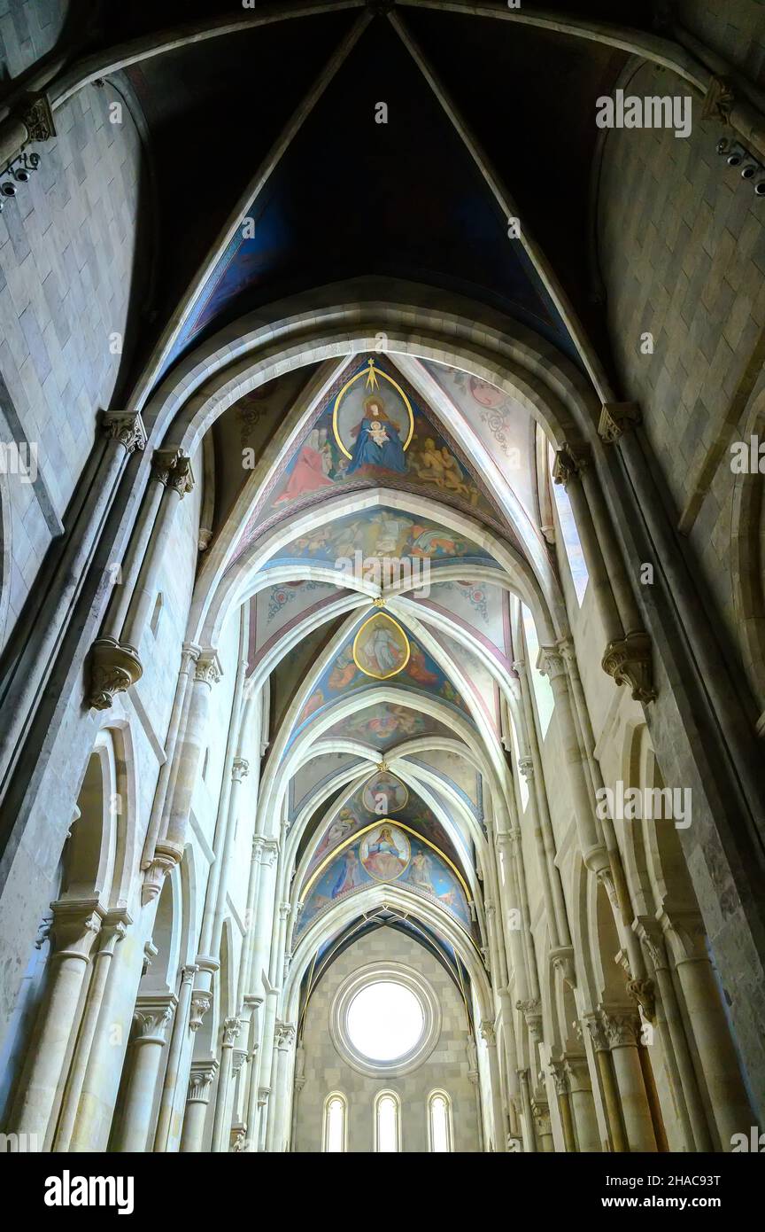 PANNONHALMA, HUNGARY - AUGUST 13, 2021: Interior of Pannonhalma Benedictine abbey with the painting of the ceiling in front of the altar in Pannonhalm Stock Photo