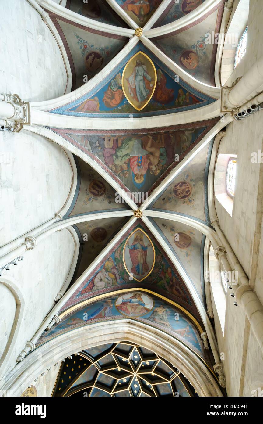 PANNONHALMA, HUNGARY - AUGUST 13, 2021: Interior of Pannonhalma Benedictine abbey with the painting of the ceiling in front of the altar in Pannonhalm Stock Photo