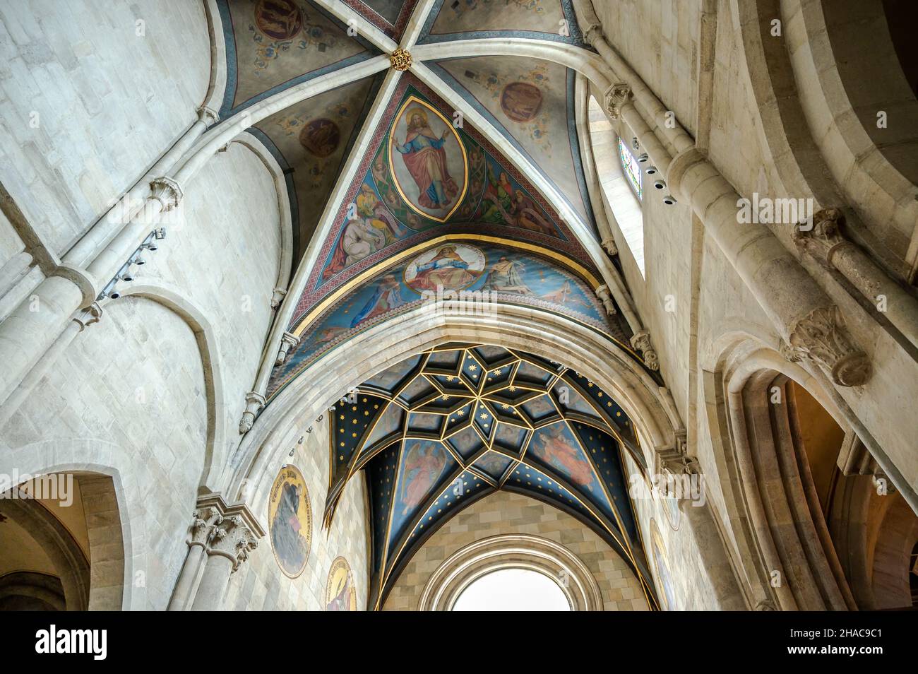 PANNONHALMA, HUNGARY - AUGUST 13, 2021: Interior of Pannonhalma Benedictine abbey with the painting of the ceiling in front of the altar in Pannonhalm Stock Photo