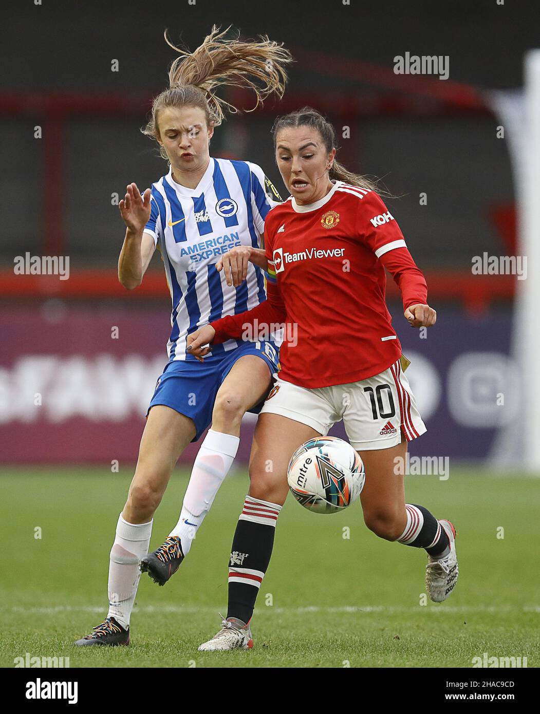 Crawley, UK. 12th Dec, 2021. Ellie Brazil of Brighton and Hove Albion and Katie Zelem of Manchester United challenge for the ball during the The FA Women's Super League match at The People's Pension Stadium, Crawley. Picture credit should read: Paul Terry/Sportimage Credit: Sportimage/Alamy Live News Credit: Sportimage/Alamy Live News Stock Photo
