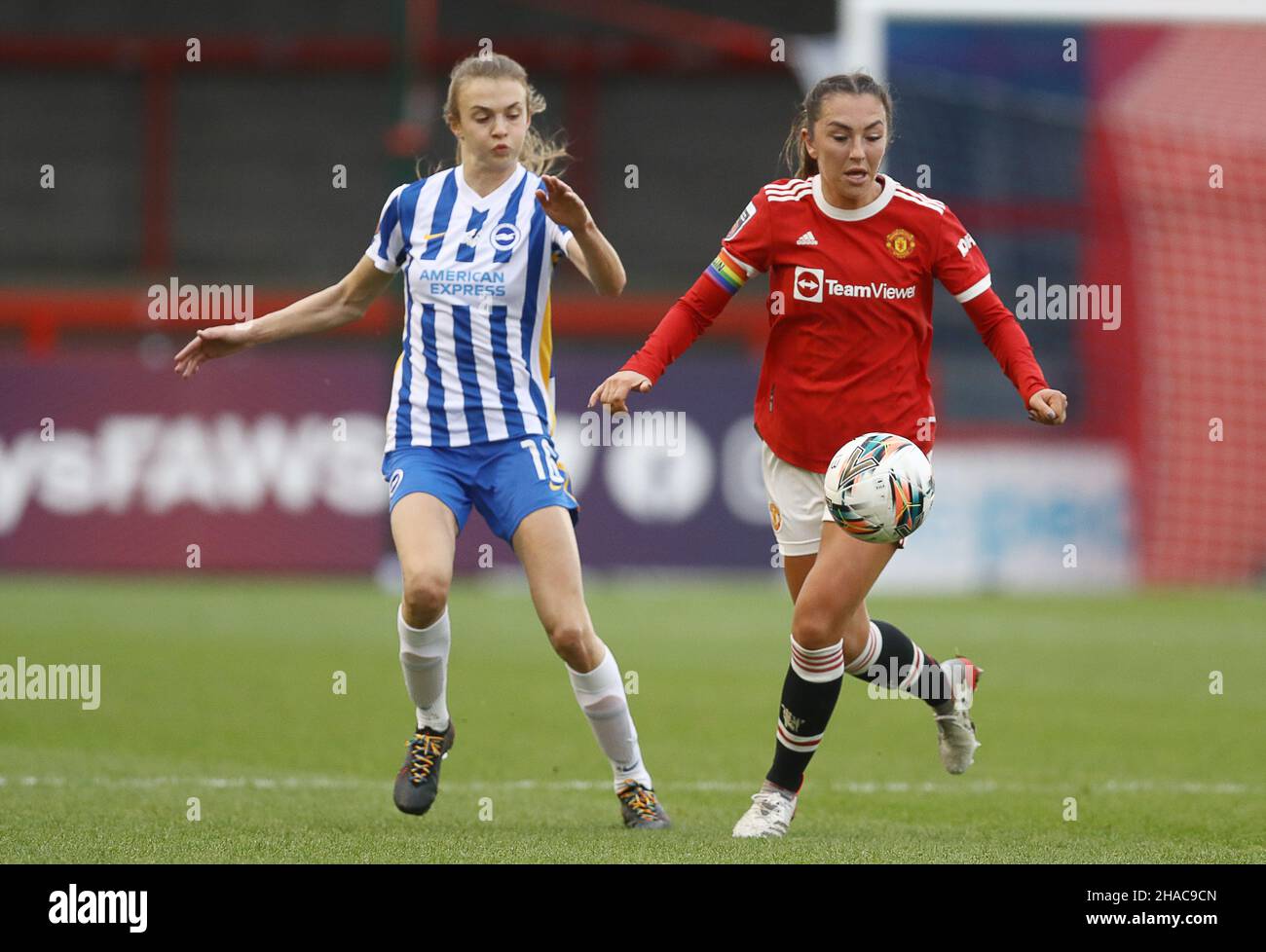 Crawley, UK. 12th Dec, 2021. Ellie Brazil of Brighton and Hove Albion and Katie Zelem of Manchester United challenge for the ball during the The FA Women's Super League match at The People's Pension Stadium, Crawley. Picture credit should read: Paul Terry/Sportimage Credit: Sportimage/Alamy Live News Credit: Sportimage/Alamy Live News Stock Photo