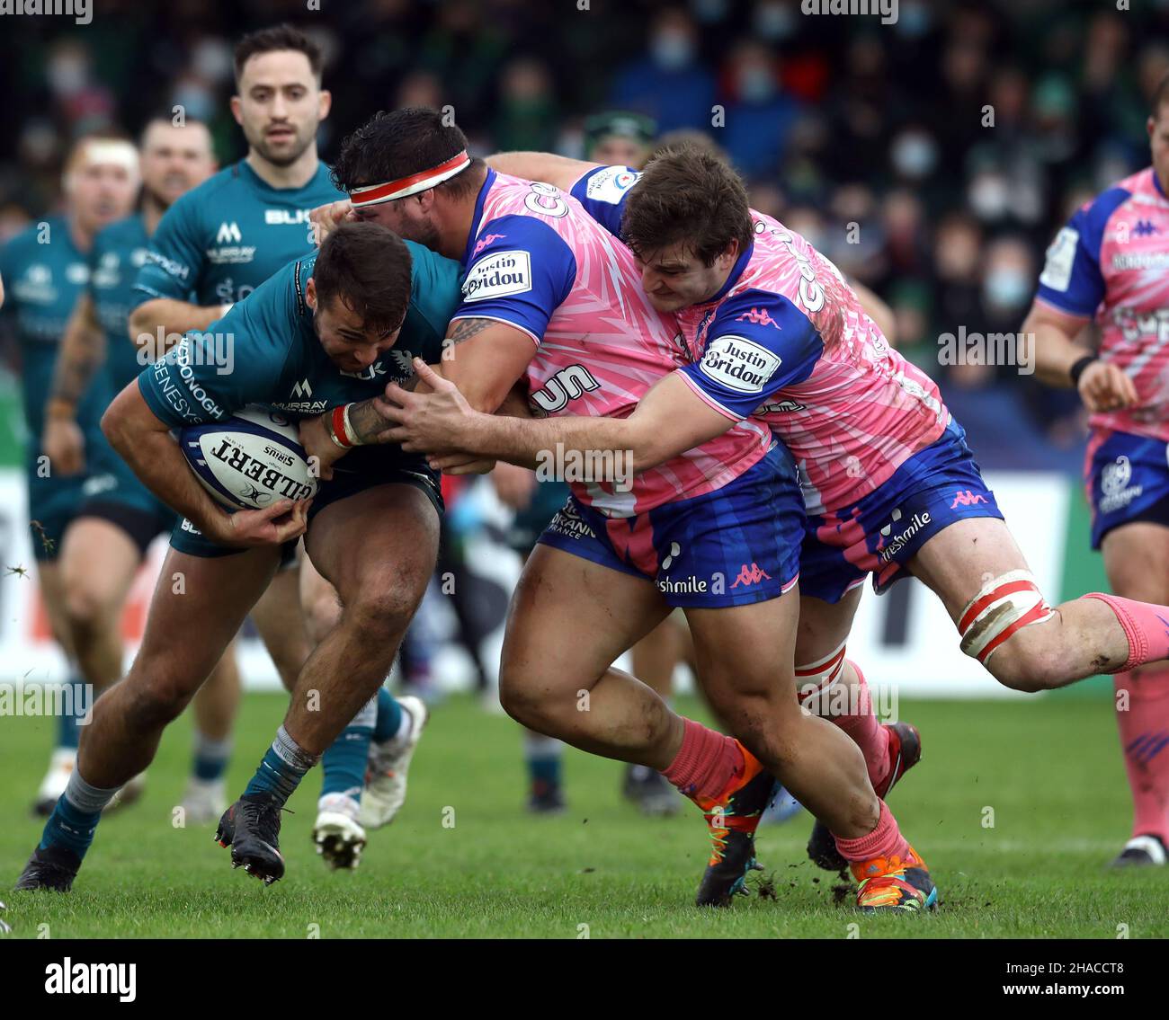 Connacht's Shayne Bolton tackled by Stade Francais' Nemo Roelofse and Mathieu De Giovanni during the Heineken Champions Cup Pool B match at The Galway Sportsgrounds in Galway, Ireland. Picture date: Sunday December 12, 2021. Stock Photo