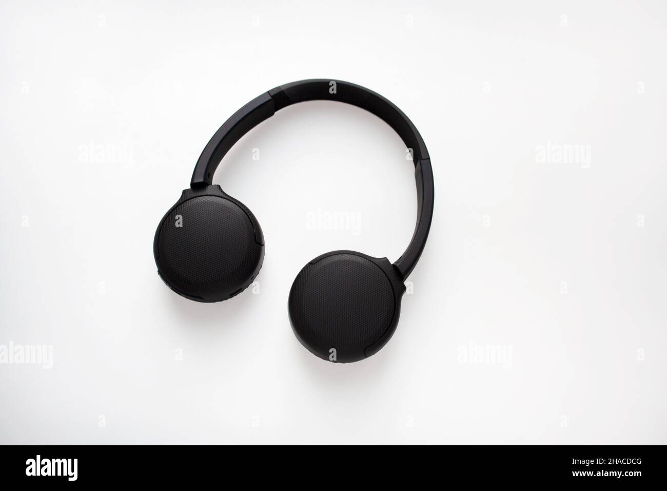 Black wireless headphones isolated on white background Stock Photo - Alamy