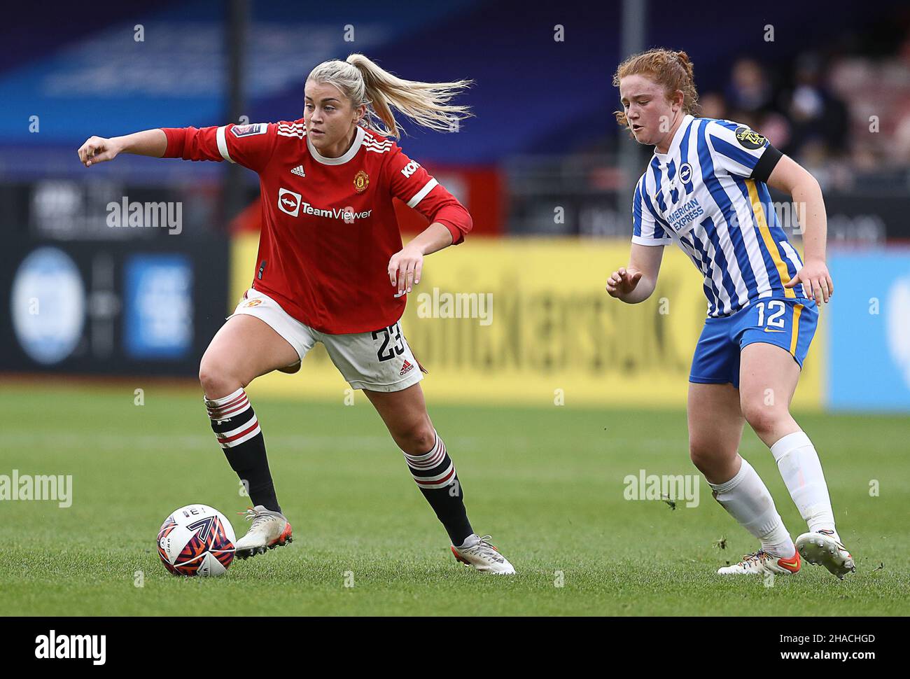 Crawley, UK. 12th Dec, 2021. Alessia Russo of Manchester United is challenged by Libby Bance of Brighton and Hove Albion during the The FA Women's Super League match at The People's Pension Stadium, Crawley. Picture credit should read: Paul Terry/Sportimage Credit: Sportimage/Alamy Live News Stock Photo