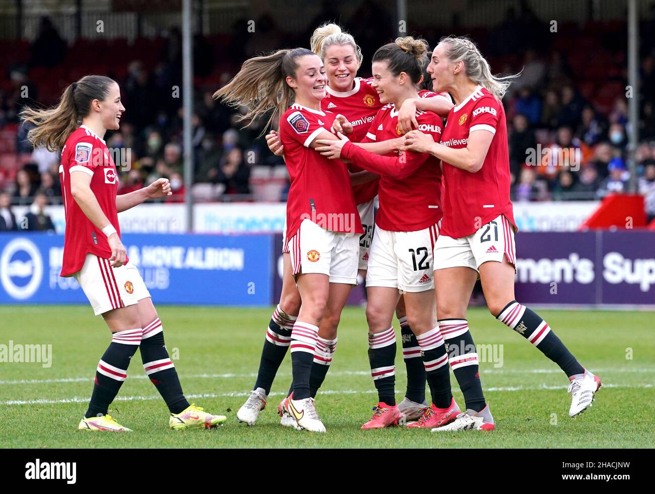 Manchester United's Hayley Ladd (second right) celebrates scoring their side's first goal of the game during the Barclays FA Women's Super League match at The People's Pension Stadium, Brighton. Picture date: Sunday December 12, 2021. Stock Photo