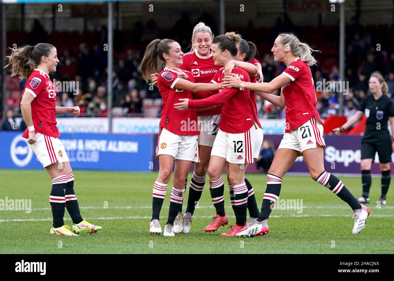 Manchester United's Hayley Ladd (centre) celebrates scoring their side's first goal of the game during the Barclays FA Women's Super League match at The People's Pension Stadium, Brighton. Picture date: Sunday December 12, 2021. Stock Photo
