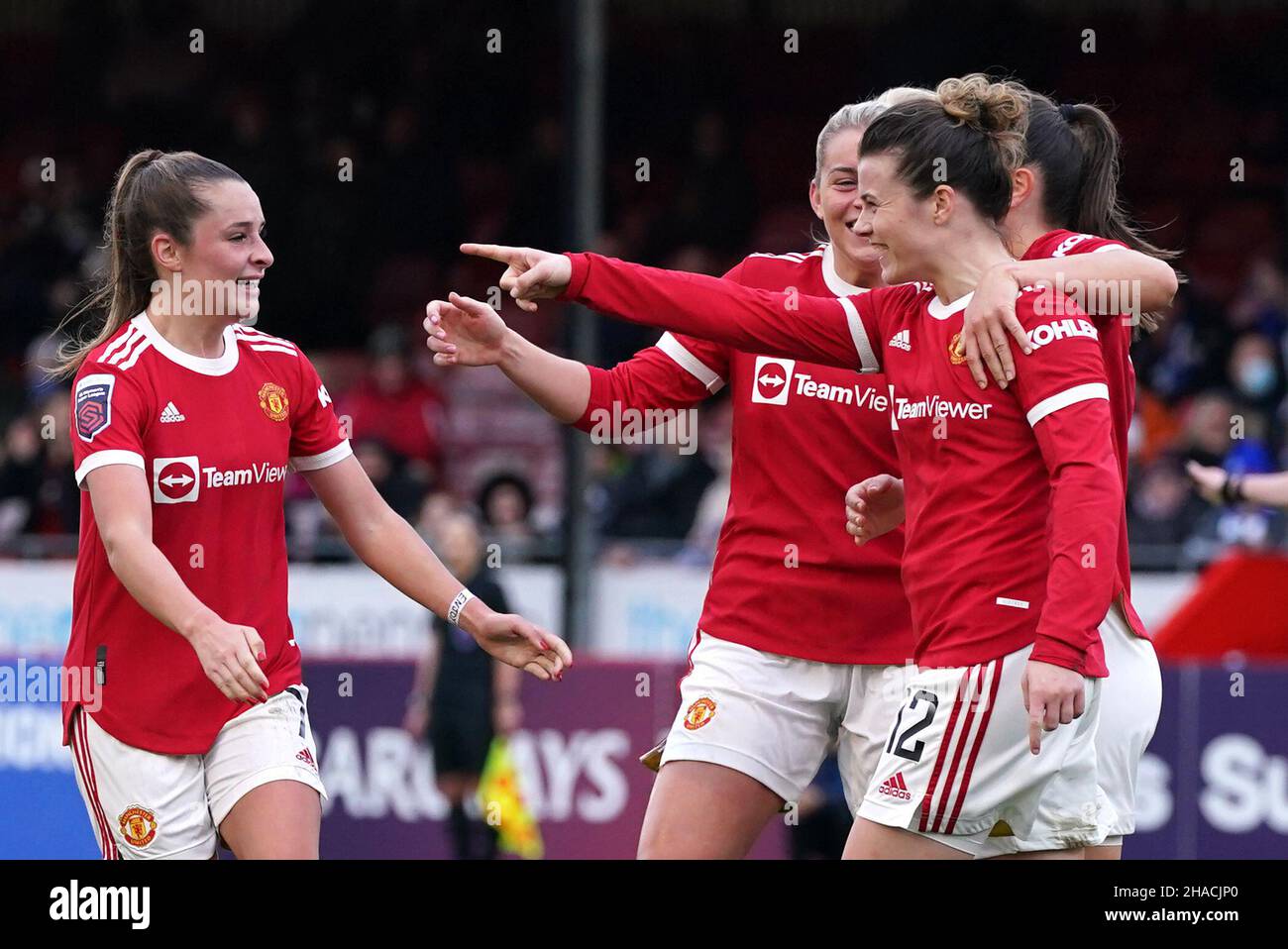 Manchester United's Hayley Ladd (right) celebrates scoring their side's first goal of the game during the Barclays FA Women's Super League match at The People's Pension Stadium, Brighton. Picture date: Sunday December 12, 2021. Stock Photo