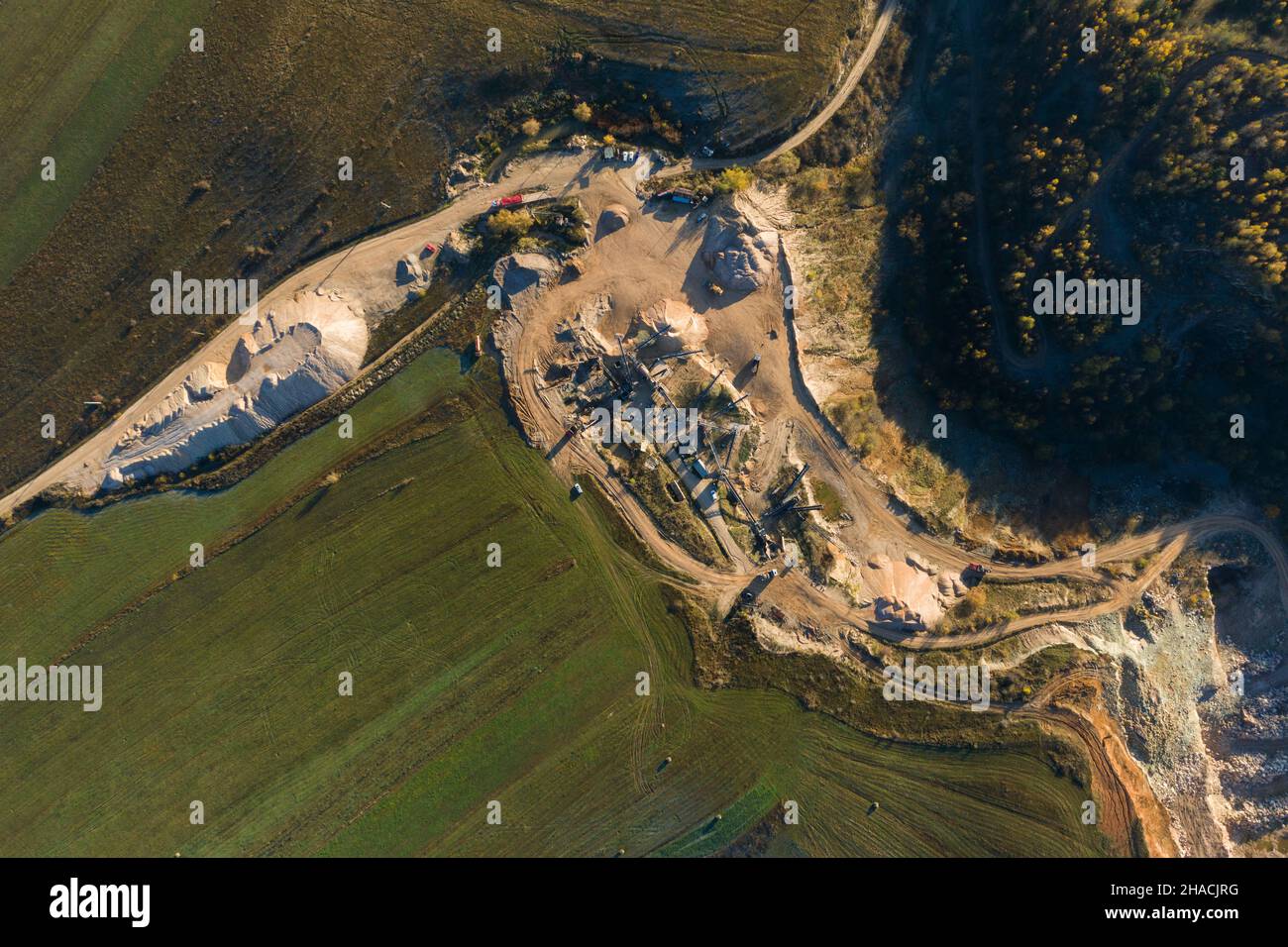 Aerial drone view of mining quarry, crushing machinery, processing plant for crushed stone and gravel Stock Photo