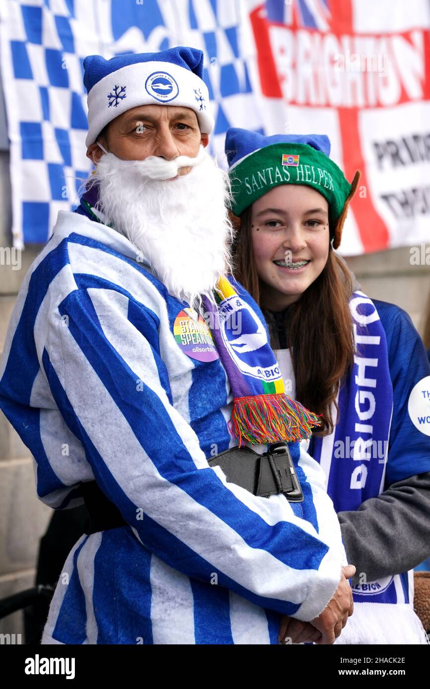 Festive Brighton and Hove Albion fans in the stands during the Barclays FA Women's Super League match at The People's Pension Stadium, Brighton. Picture date: Sunday December 12, 2021. Stock Photo