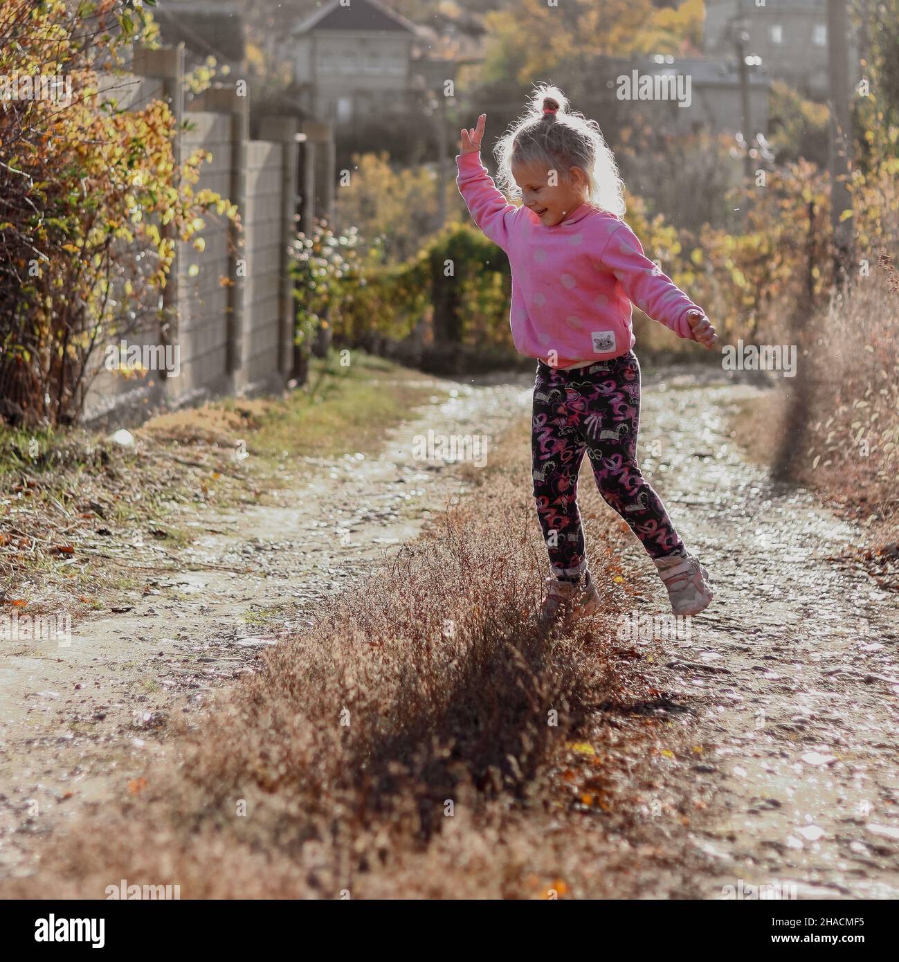 Baby 4 years old runs and jumps in the open air. Childhood moments ...