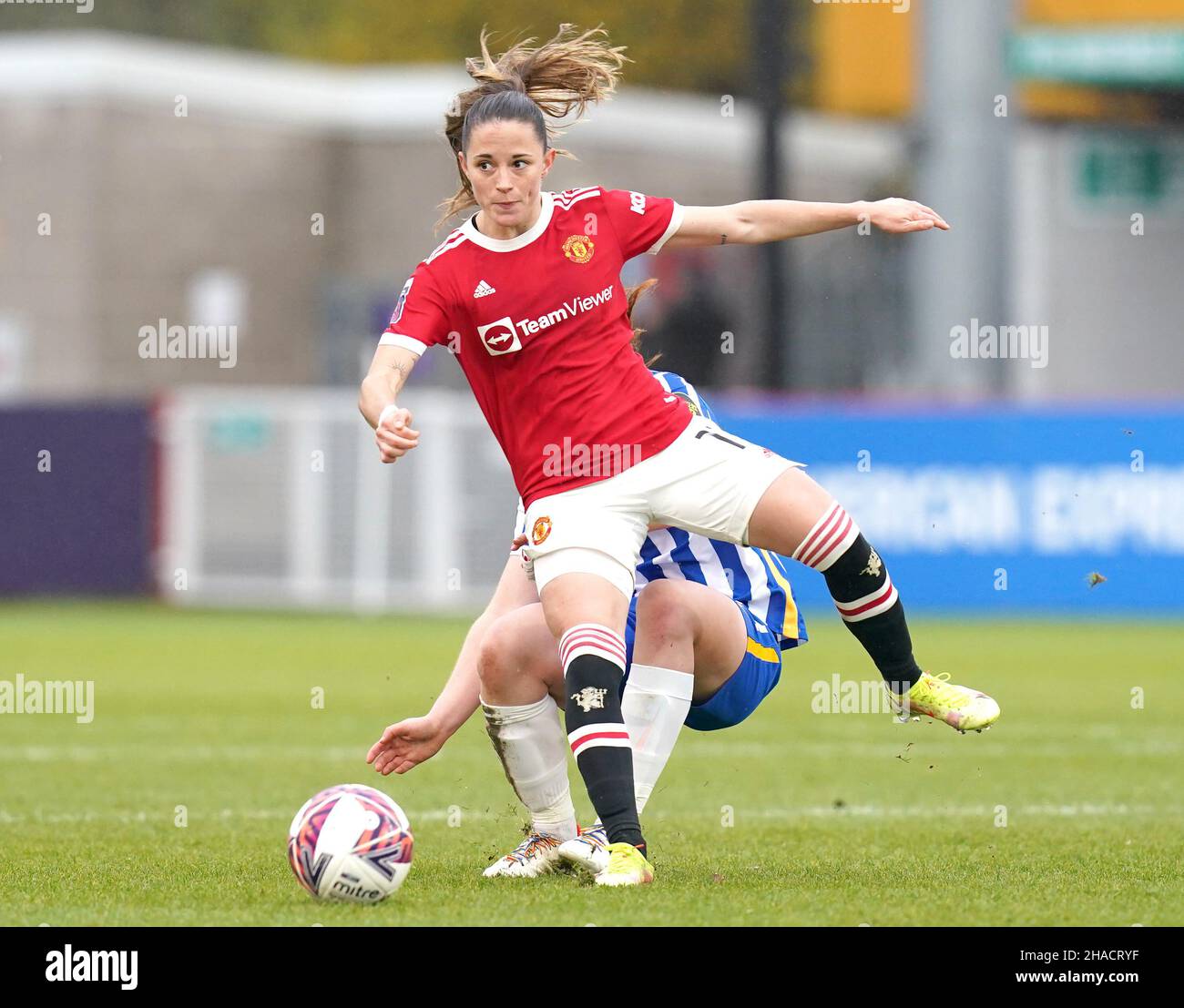 Manchester United's Ona Batlle (front) and Brighton and Hove Albion's Libby Bance battle for the ball during the Barclays FA Women's Super League match at The People's Pension Stadium, Brighton. Picture date: Sunday December 12, 2021. Stock Photo