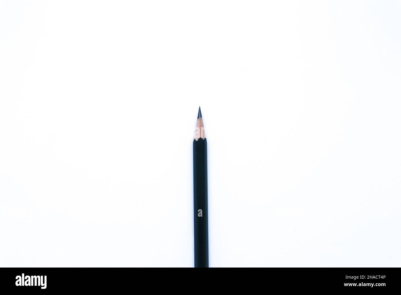 Flat Lay Shot of A Black Pencil in The White Background, Landscape Mode and Minimalist Stock Photo