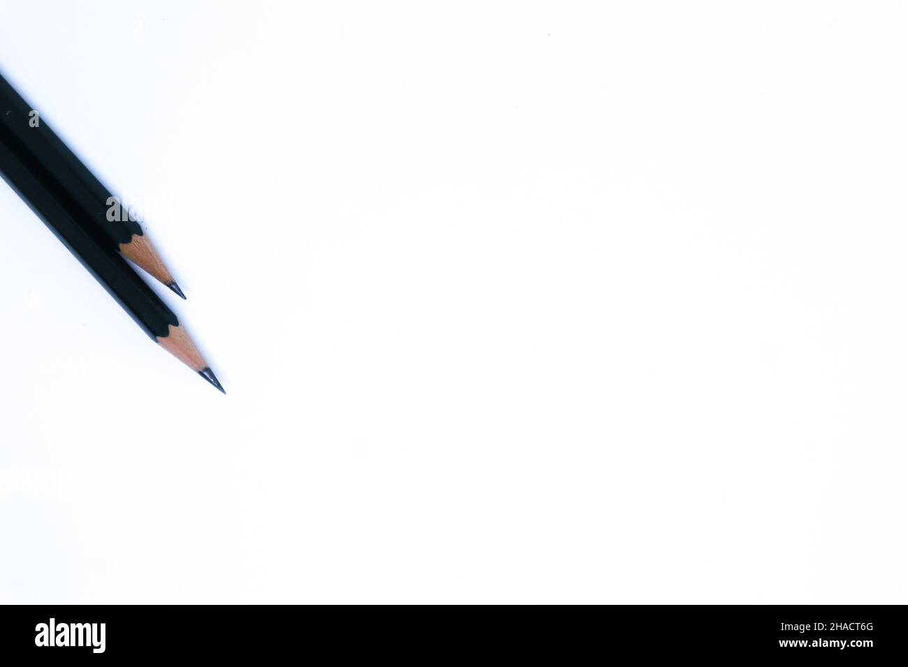 Two Pencils in The Corner of White Background with Flat Lay Shot, Landscape Mode and Minimalist Stock Photo
