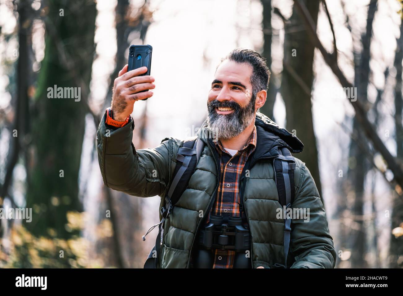 Image of man enjoys hiking and making selfie with his phone Stock Photo ...