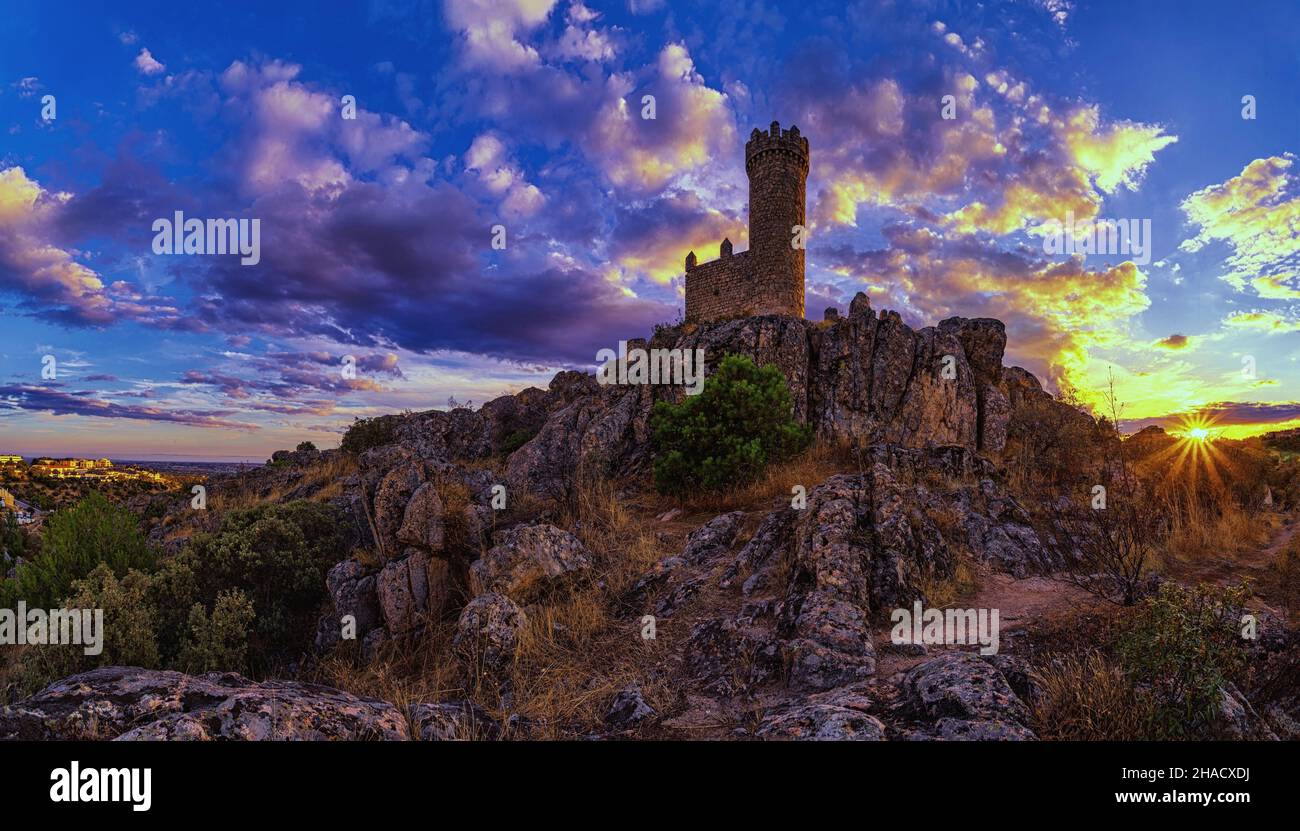 A castle on the rocky hill under a sunset sky Stock Photo - Alamy