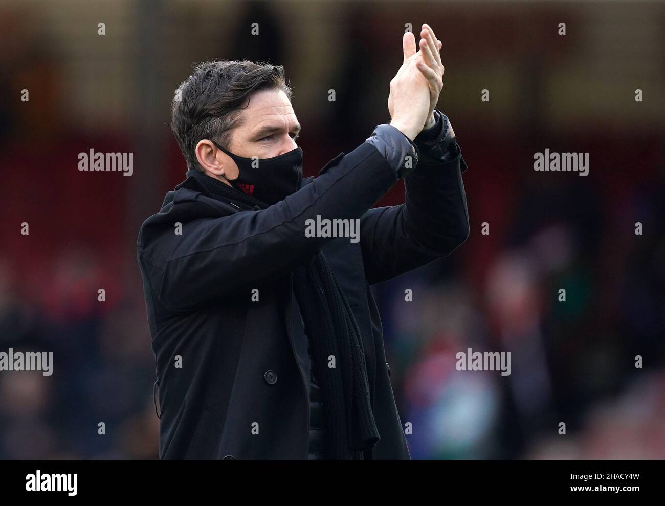 Manchester United manager Marc Skinner applauds the fans after the Barclays FA Women's Super League match at The People's Pension Stadium, Brighton. Picture date: Sunday December 12, 2021. Stock Photo