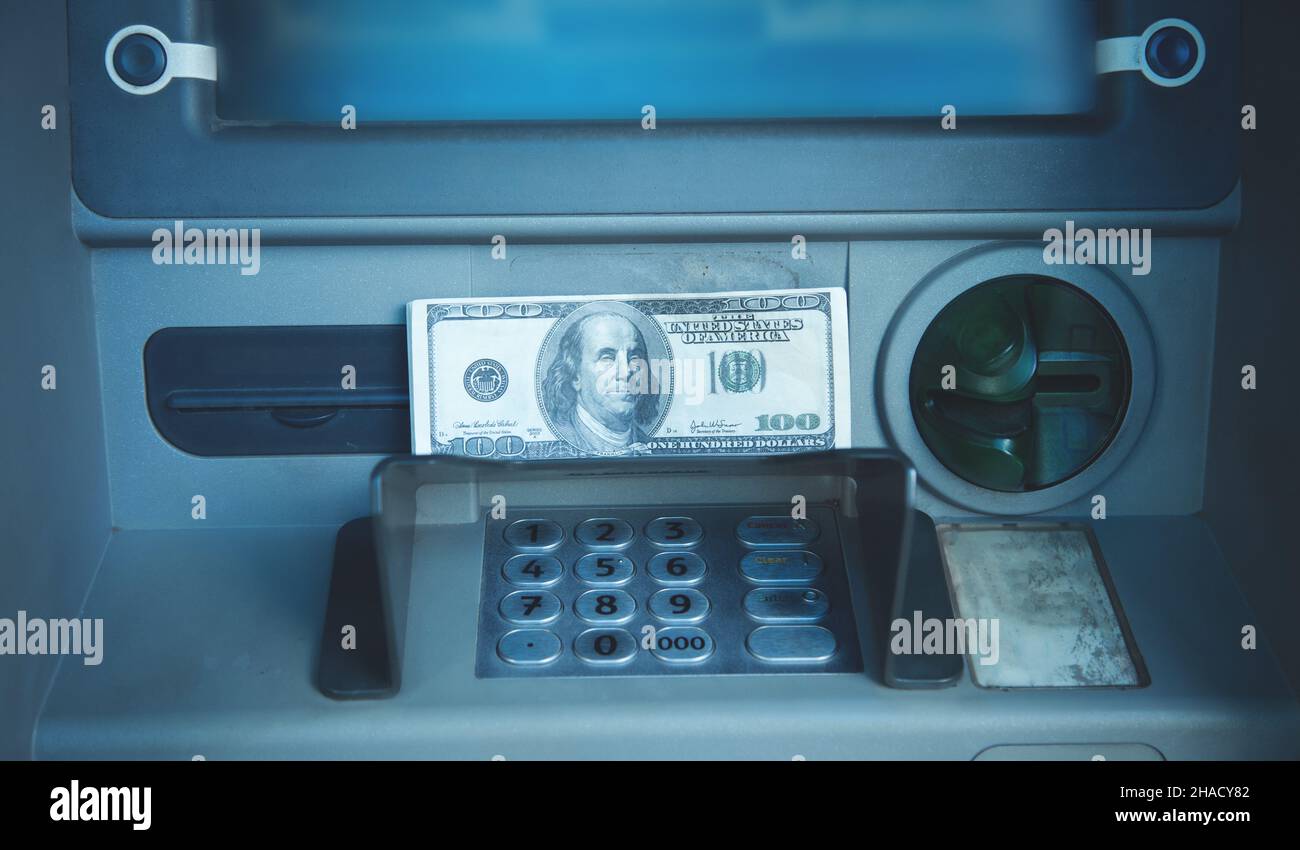 Dollar banknotes. ATM. Withdraw money Stock Photo
