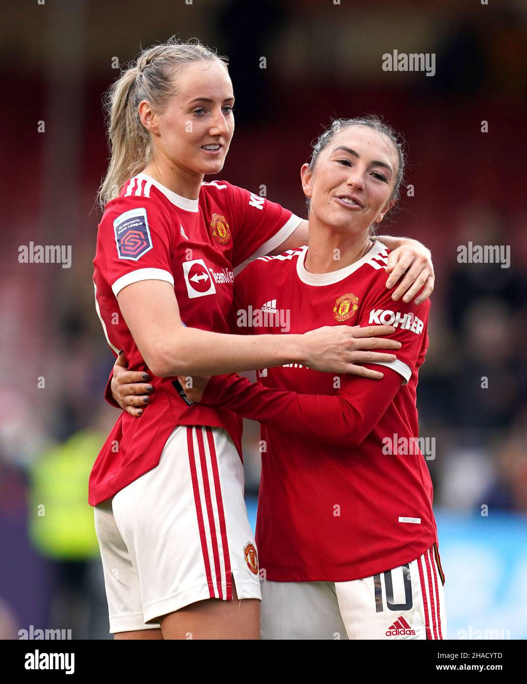 Manchester United's Millie Turner (left) and Katie Zelem celebrate after the Barclays FA Women's Super League match at The People's Pension Stadium, Brighton. Picture date: Sunday December 12, 2021. Stock Photo