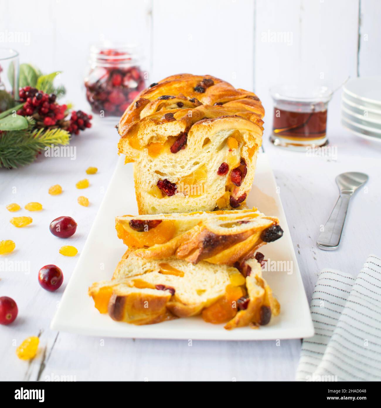 Christmas yeast cake with dried apricots and cranberries. Stock Photo