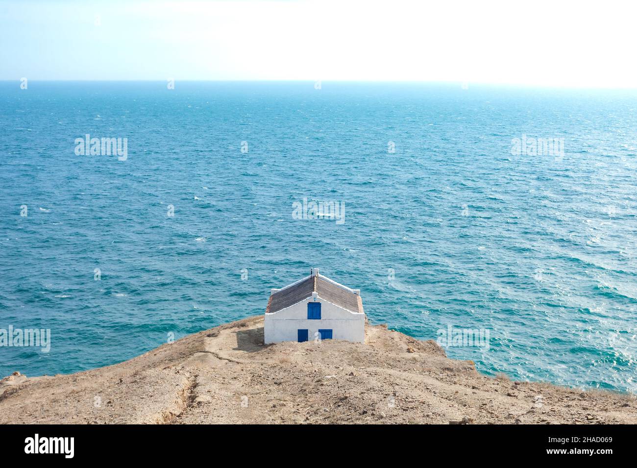 Simple house on the edge of a cliff overlooking the sea Stock Photo - Alamy