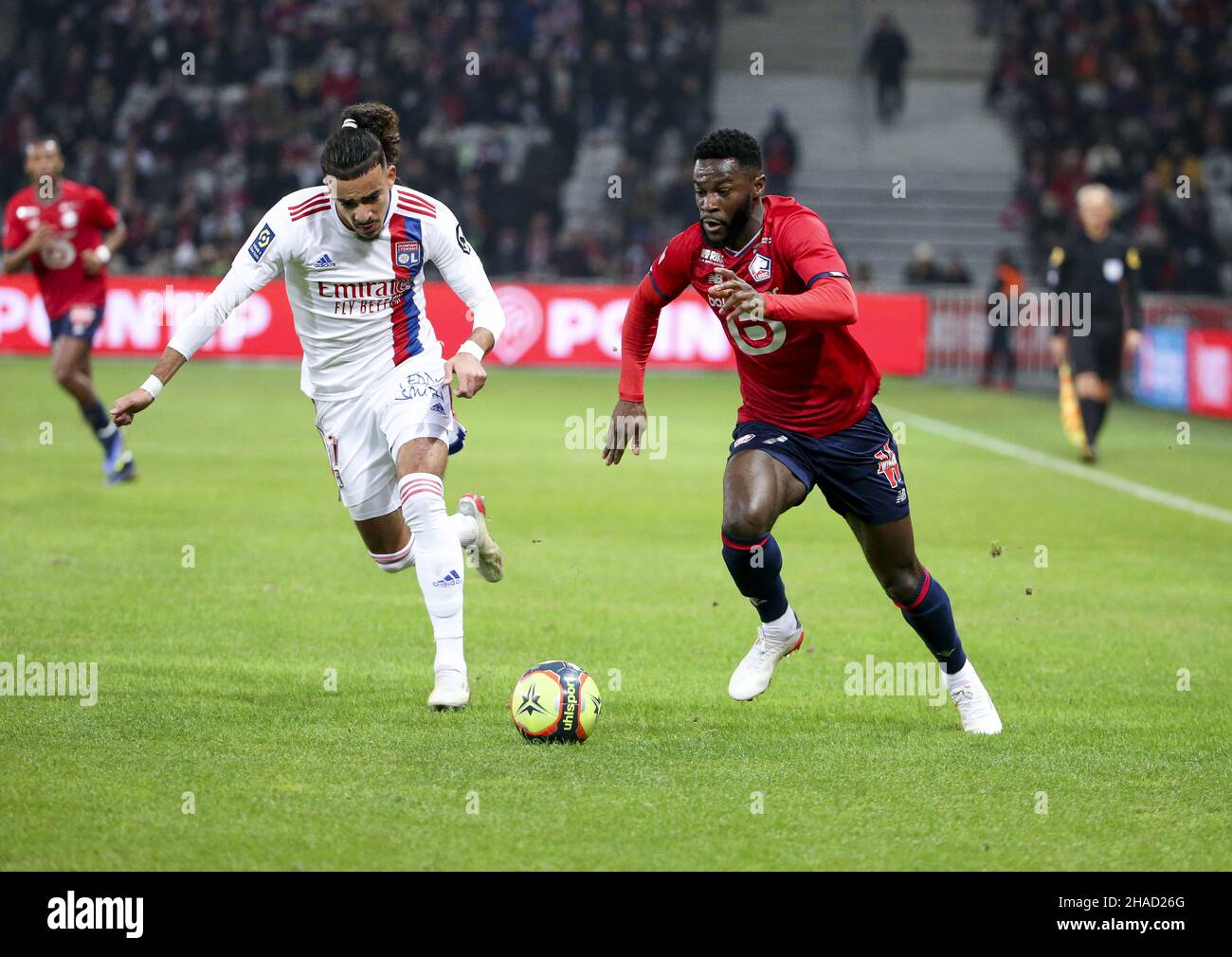 Jonathan Bamba of Lille, Malo Gusto of Lyon (left) during the French championship Ligue 1 football match between Lille OSC (LOSC) and Olympique Lyonnais (Lyon, OL) on December 12, 2021 at Stade Pierre Mauroy in Villeneuve-d'Ascq near Lille, France - Photo: Jean Catuffe/DPPI/LiveMedia Stock Photo