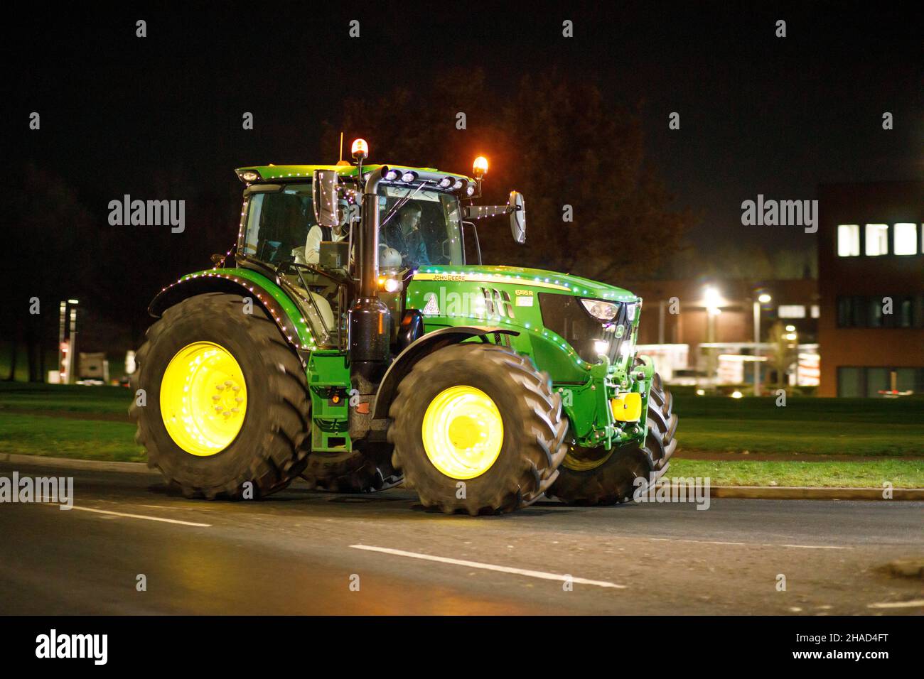 The third annual Christmas decorated tractor parade. Over 70 tractors covered in bright festive lights made their way through the villages of Warwickshire over two evenings. The event is organised by the Sheepy Ploughing Association. The farmers raised over twenty thousand pounds. Stock Photo
