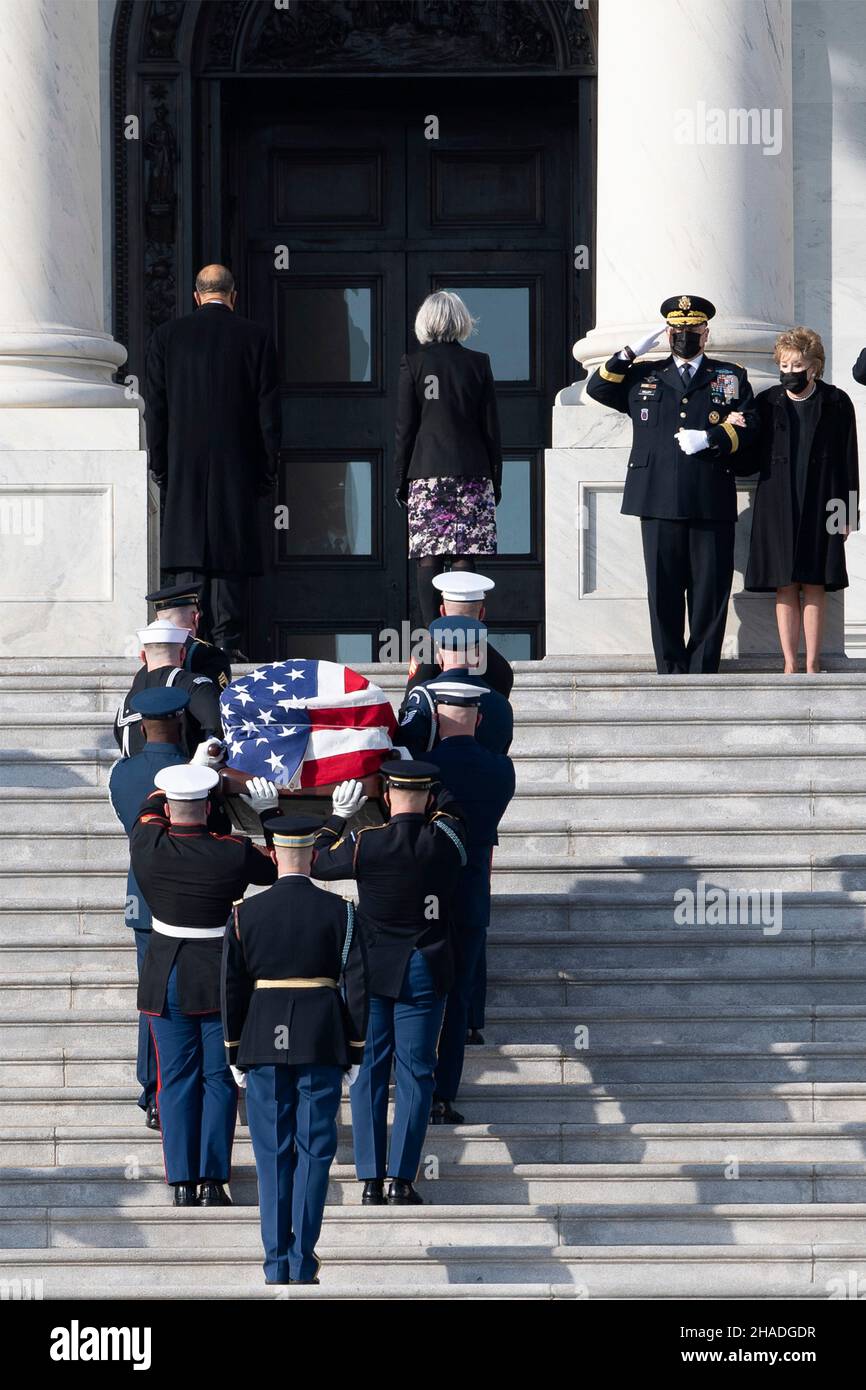 Washington, United States of America. 09 December, 2021. U.S. Chairman of the Joint Chiefs Gen. Mark Milley and former Senator Elizabeth Dole render honors as Armed Forces honor guard carry the flag-draped casket of World War II veteran and former Senator Robert Dole up the steps of the U.S. Capitol where it will lay in state, December 9, 2021 in Washington, D.C. Senator Dole died at age 98 following a lifetime of service to the nation.  Credit: Sgt. Kevin Roy/U.S. Army/Alamy Live News Stock Photo