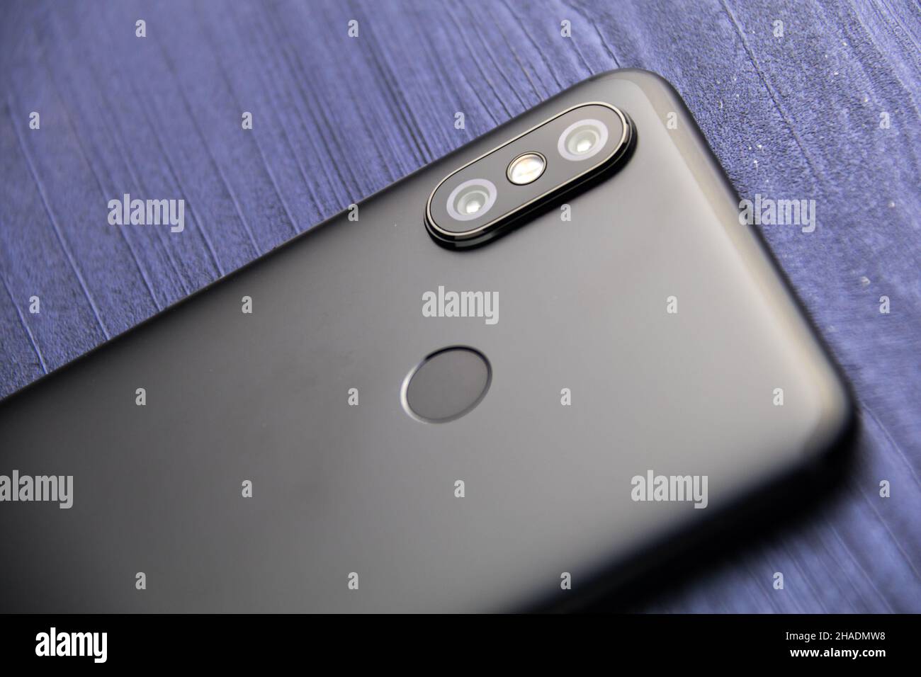 A black smartphone with two cameras and fingerprint reader. Dual camera ...