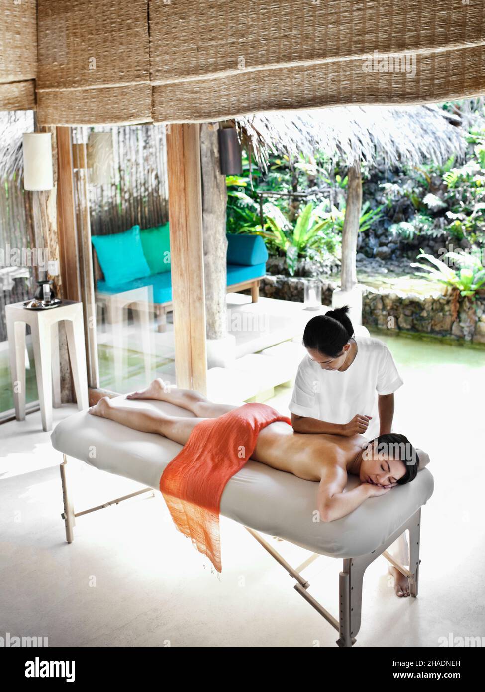 A woman receives a massage combining Swedish, Thai massage and Aroma therapy. Yao Noi, Thailand. Stock Photo