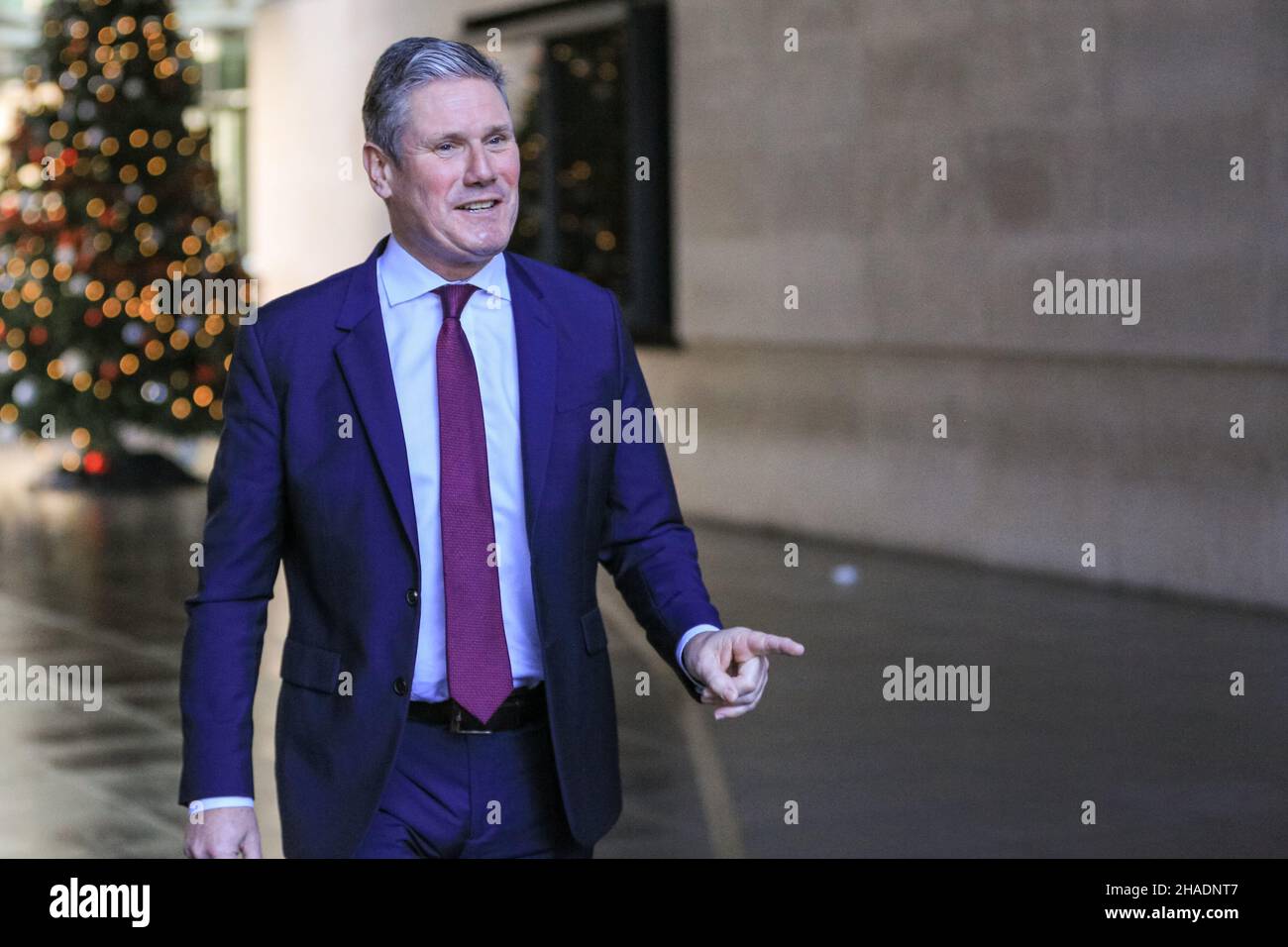 London, UK. 12th Dec, 2021. Sir Keir Starmer KCB QC MP, Leader of the Labour Party, exits the BBC headquarters in London and is interviewed, following an appearance at the Andrew Marr Show. Starmer reacted to the latest set of proposed covid measures, as well as PM Boris Johnson's stance on alleged Christmas parties at Downing Street and in several government departments. Credit: Imageplotter/Alamy Live News Stock Photo