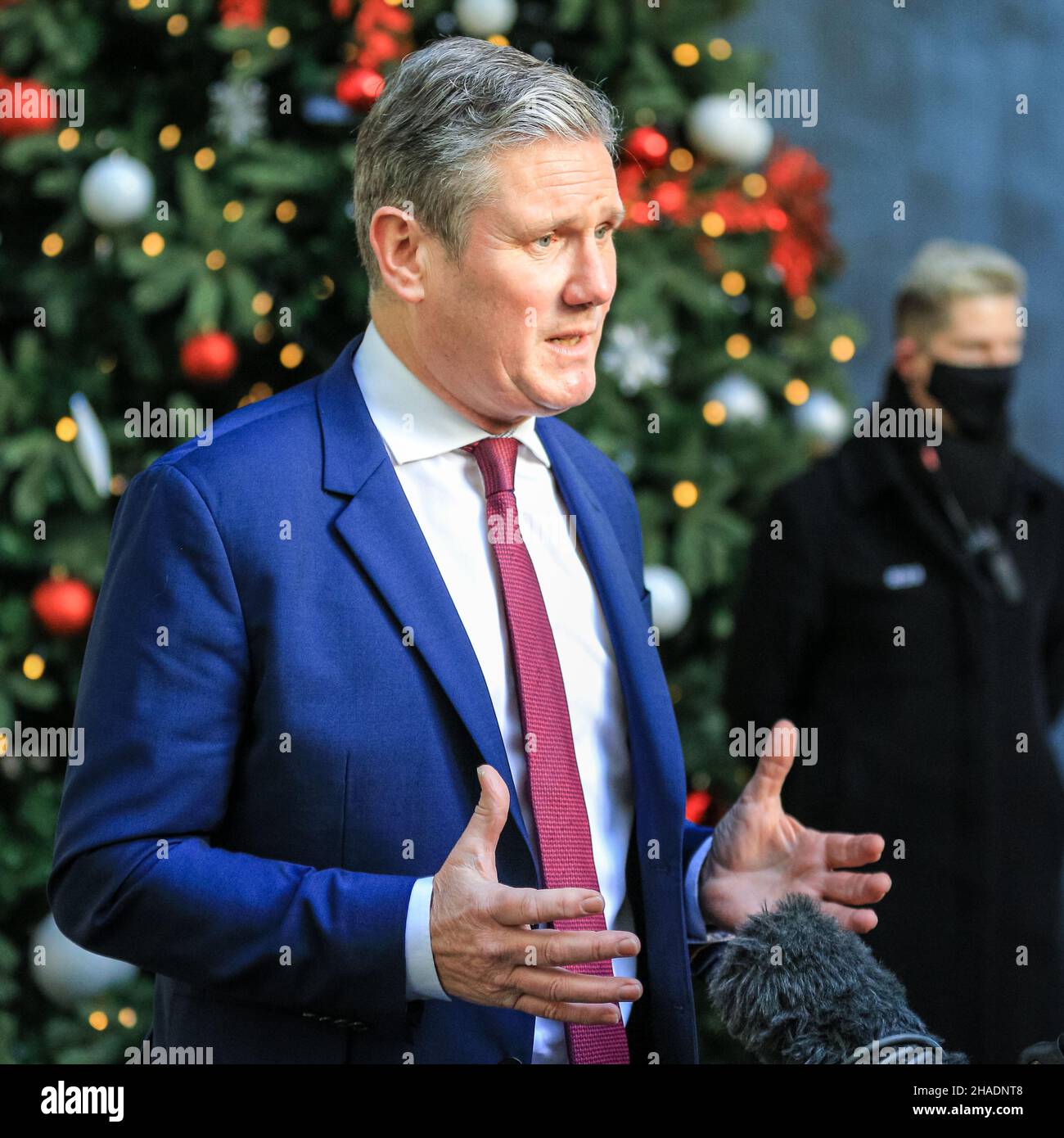 London, UK. 12th Dec, 2021. Sir Keir Starmer KCB QC MP, Leader of the Labour Party, exits the BBC headquarters in London and is interviewed, following an appearance at the Andrew Marr Show. Starmer reacted to the latest set of proposed covid measures, as well as PM Boris Johnson's stance on alleged Christmas parties at Downing Street and in several government departments. Credit: Imageplotter/Alamy Live News Stock Photo
