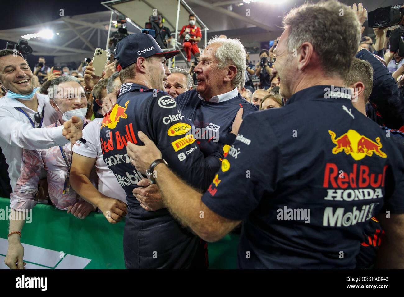 Abu Dhabi. 12th December, 2021. VERSTAPPEN Max (nld), Red Bull Racing Honda RB16B, portrait, celebrating his win and first world title at 24 years old with Helmut Marko and Christian Horner during the Formula 1 Etihad Airways Abu Dhabi Grand Prix 2021, 22th round of the 2021 FIA Formula One World Championship from December 10 to 12, 2021 on the Yas Marina Circuit, in Yas Island, Abu Dhabi - Photo Florent Gooden / DPPI Stock Photo