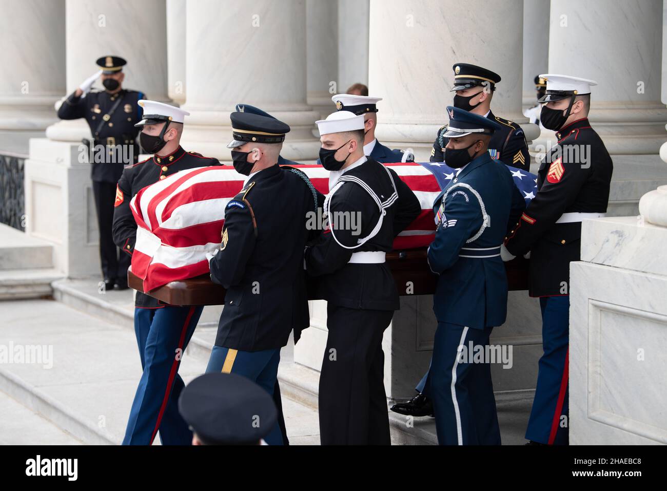 Washington, United States Of America. 10th Dec, 2021. Washington, United States of America. 10 December, 2021. U.S. Armed Forces honor guard carry the flag-draped casket of World War II veteran and former Senator Robert Dole down the steps of the U.S. Capitol, December 10, 2021 in Washington, DC Senator Dole died at age 98 following a lifetime of service to the nation. Credit: Sgt. Kevin Roy/U.S. Army/Alamy Live News Stock Photo