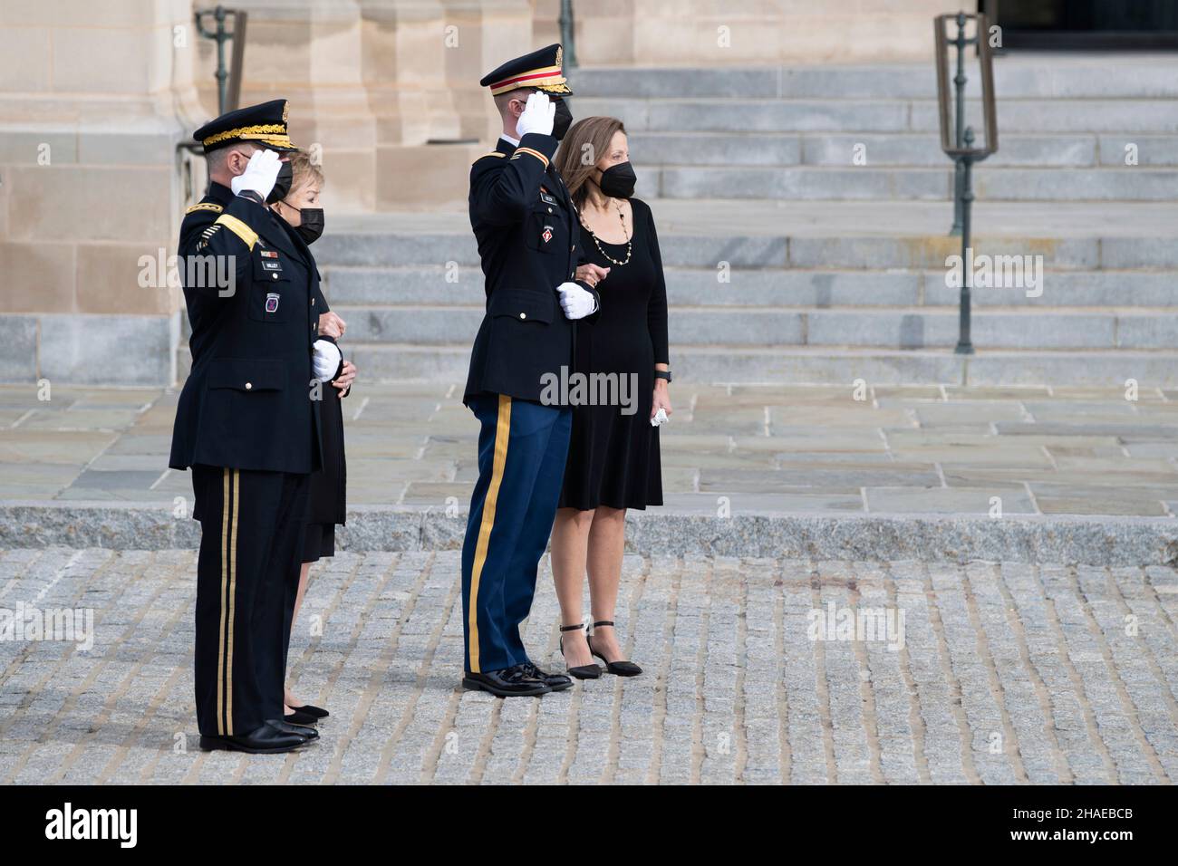 Washington, United States Of America. 10th Dec, 2021. Washington, United States of America. 10 December, 2021. U.S. Chairman of the Joint Chiefs of Staff General Mark Milley and Army Maj. Garrett Beer render honors, as former Senator Elizabeth Dole and daughter Robin Dole watch as Armed Forces honor guard carry the flag-draped casket of World War II veteran and former Senator Robert Dole down the steps of the U.S. Capitol, December 10, 2021 in Washington, DC Senator Dole died at age 98 following a lifetime of service to the nation. Credit: Laura Buchta/U.S. Army/Alamy Live News Stock Photo