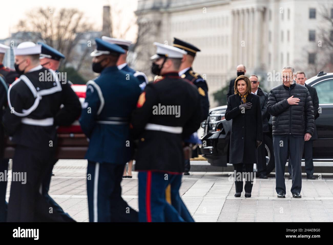 Washington, United States Of America. 10th Dec, 2021. Washington, United States of America. 10 December, 2021. Senate Majority Leader Chuck Schumer, right, and House Speaker Nancy Pelosi, salute as an Armed Forces honor guard carry the remains of World War II veteran and former Senator Robert Dole on departure from the U.S. Capitol, December 10, 2021 in Washington, DC Senator Dole died at age 98 following a lifetime of service to the nation. Credit: Sgt. Zachery Perkins/U.S. Army/Alamy Live News Stock Photo